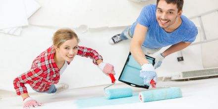 couple painting a wall